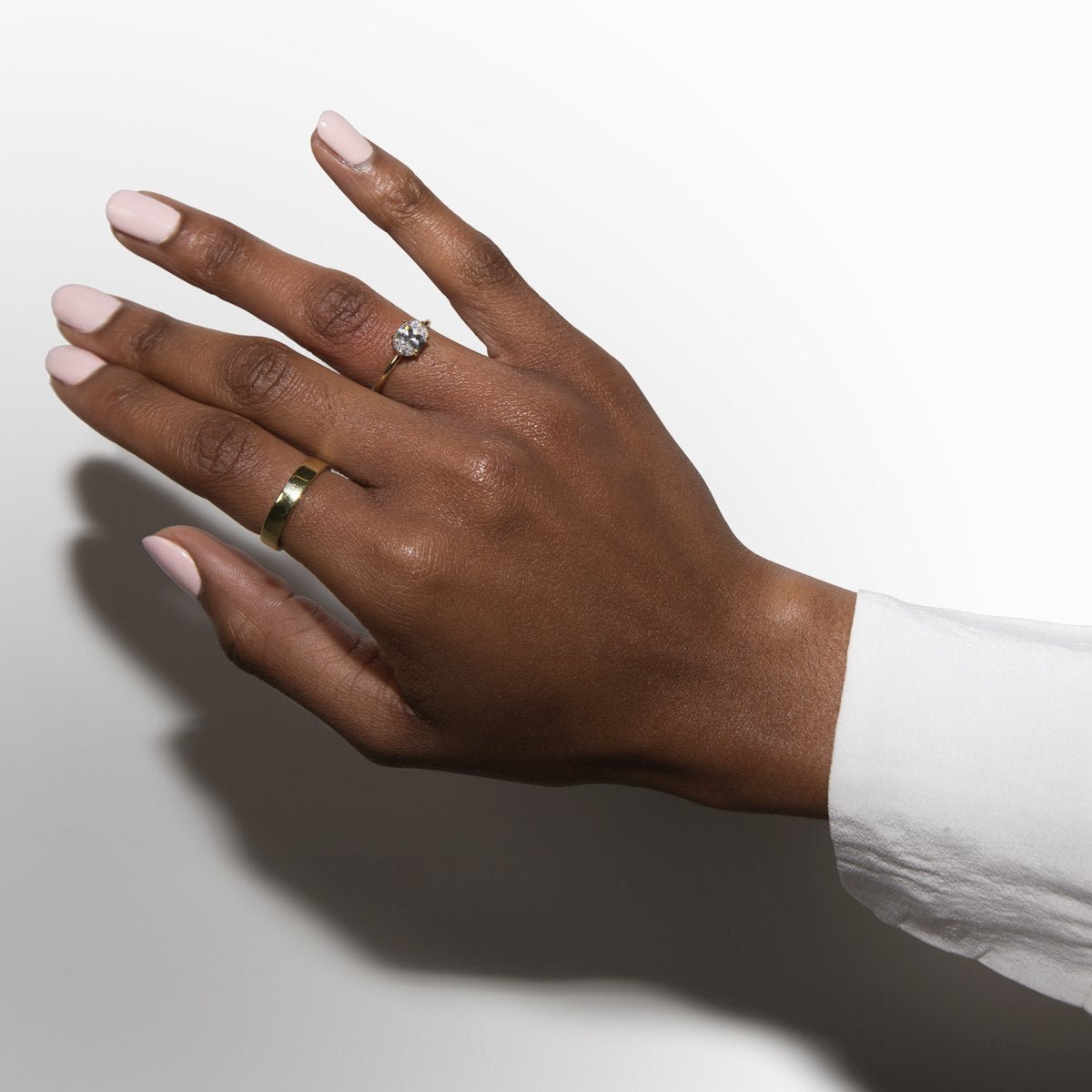 East - West Hidden Halo Engagement Ring