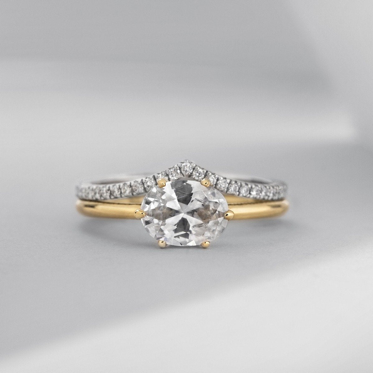 East - West Hidden Halo Engagement Ring