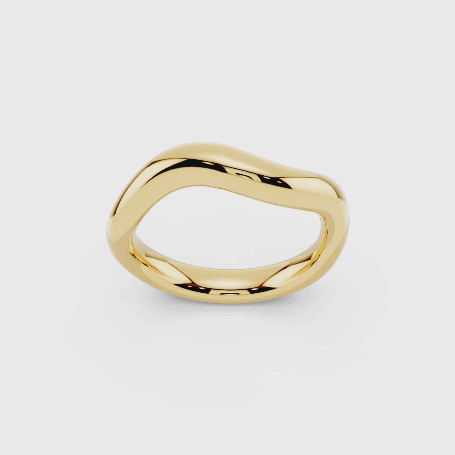 Yellow gold sculptural wave band showing flowing organic design detail video