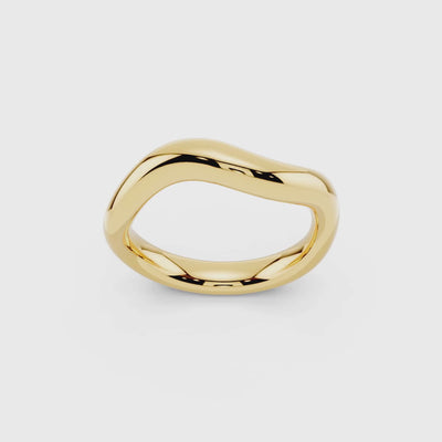 Yellow gold sculptural wave band showing flowing organic design detail video