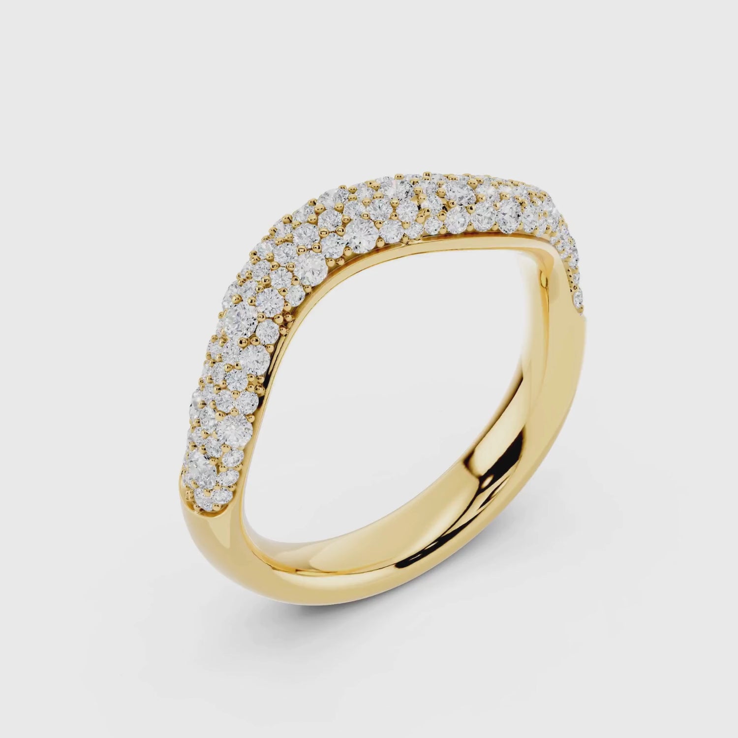 Close-up of yellow gold diamond pave wave band showing sparkle detail